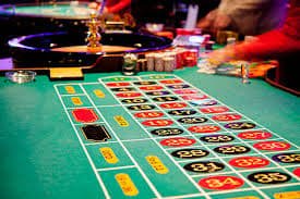 Filipino player spinning slot reels on mobile phone